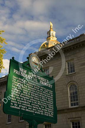 Presidential primary sign and gold dome of the capitol building in the city of Concord, New Hampshire, USA.