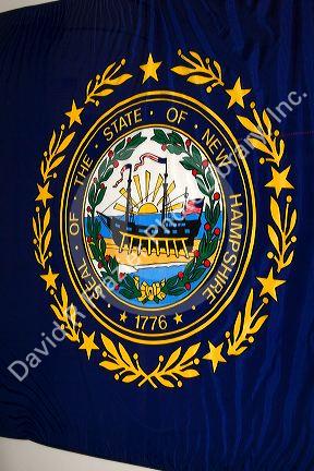 New Hampshire flag with state seal in Concord, New Hampshire, USA.