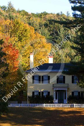 Residential home and fall foliage in the town of Orford, New Hampshire, USA.