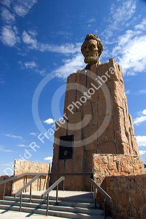 The Lincoln Highway Memorial along I-80 in Wyoming. Sign reads that it is the first cross country paved road in the United States of America.lincoln highway memorial, memorial, wyoming, sign, lincoln highway, united states, america, interstate 80, statue, lincoln bust