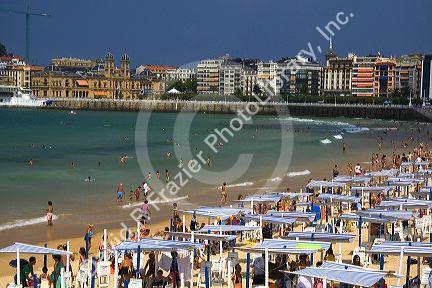 Beach scene at La Concha Bay in the city of Donostia-San Sebastian, Guipuzcoa, Basque Country, Northern Spain.