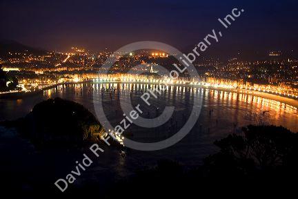 La Concha Bay and the city of Donostia-San Sebastian at night, Guipuzcoa, Basque Country, Northern Spain.