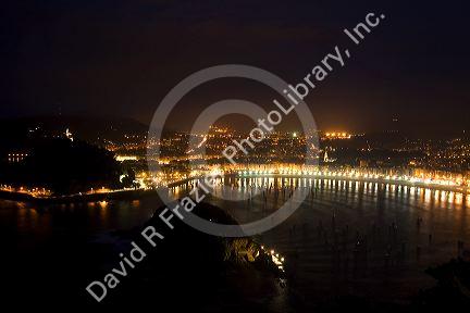 La Concha Bay and the city of Donostia-San Sebastian at night, Guipuzcoa, Basque Country, Northern Spain.