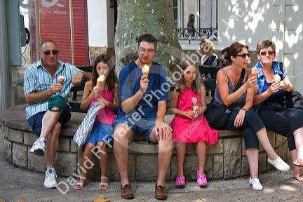 Family eating ice cream in the town of Saint-Jean-de-Luz, Pyrenees-Atlantiques, French Basque Country, Southwest France.