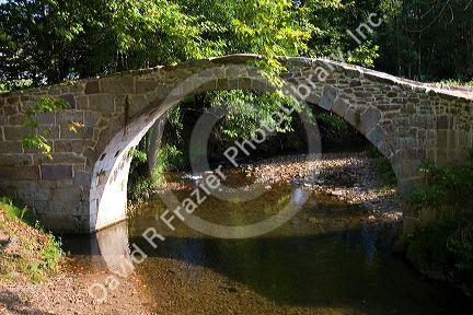 Stone footbridge near the village of Sare, Pyrenees Atlantique, French Basque Country, Southwest France.