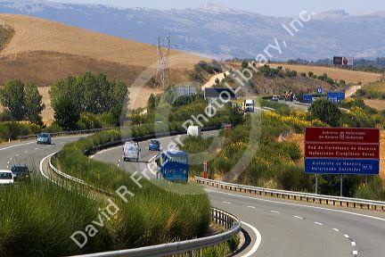 Automobiles travel on the Autopista near Pamplona, Navarre, northern Spain.
