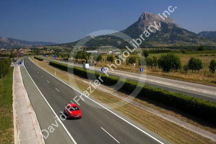 Car traveling along the A-10 Autopista near the town of Etxarri-Aranatz, Navarre, northern Spain.