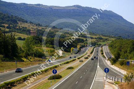 Automobiles travel along the A-10 Autopista near the town of Etxarri-Aranatz, Navarre, northern Spain.
