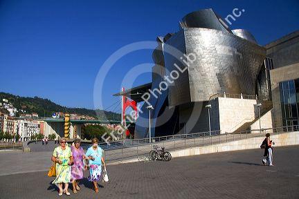 Visitors in front of the Guggenheim Museum in the city of Bilbao, Biscay, Basque Country, northern Spain.