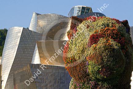 The Puppy topiary art sculpture by Jeff Koons in front of the Guggenheim Museum in the city of Bilbao, Biscay, Basque Country, northern Spain.