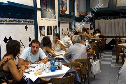 People dine at a restaurant in the city of Bilbao, Biscay, Basque Country, northern Spain.