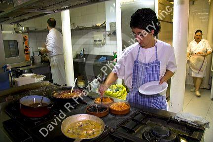 Cooks in the kitchen of a basque restaurant in the city of Bilbao, Biscay, Basque Country, Spain.