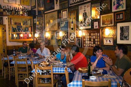 People dine at a tavern in the city of Bilbao, Biscay, Basque Country, northern Spain.