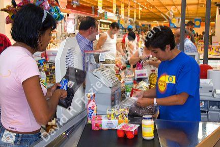 Customers in the checkout line at Eroski supermarket in the town of Castro Urdiales, Cantabria, northern Spain.