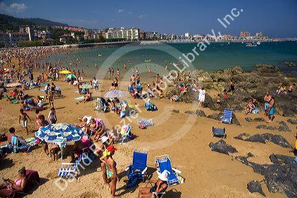 Crowded beach scene at Castro Urdiales, Cantabria, northern Spain.