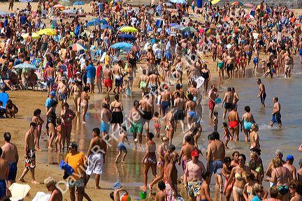Crowded beach scene at Castro Urdiales, Cantabria, northern Spain.