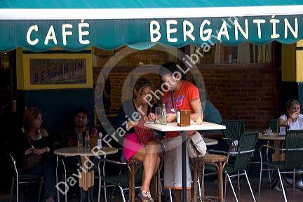 Customers paying their bill at the Cafe Bergantin in the town of Ribadesella, Asturias, northern Spain.