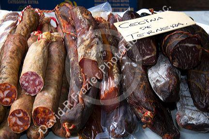 Sausage and cured meat being sold at an outdoor market in the town of Cangas de Onis, Asturias, northern Spain.