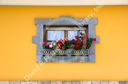 Window box with flowers on a residential home near Potes, Liebana, Cantabria, northwestern Spain.