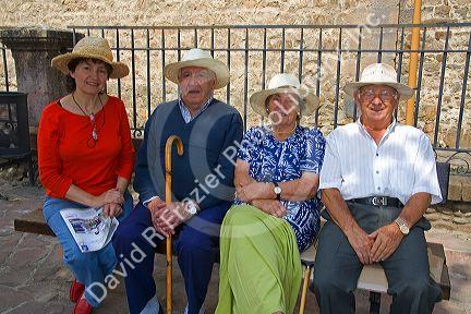 Spanish tourists wearing straw hats in the town of Potes, Liebana, Cantabria, northwestern Spain.