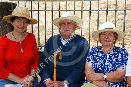Spanish tourists wearing straw hats in the town of Potes, Liebana, Cantabria, northwestern Spain.
