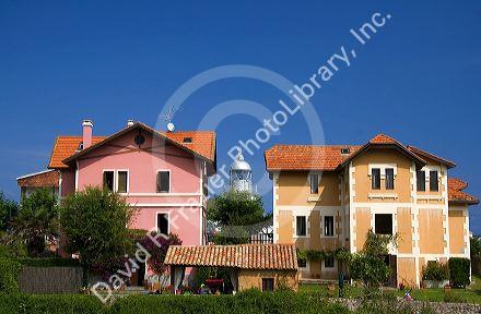 Residential houses and lighthouse in the town of Llanes, Asturias, Spain.