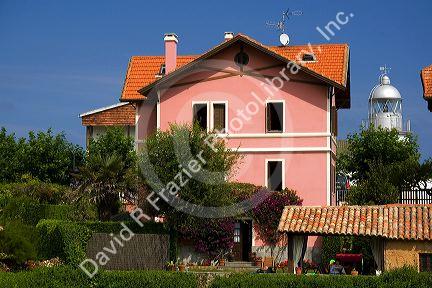 Residential home and lighthouse in the town of Llanes, Asturias, Spain.