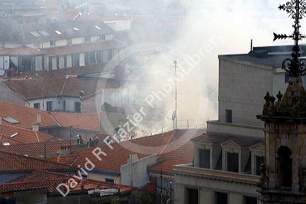 Firefighters on the roof of an apartment on fire in the city of Bilbao, Biscay, northern Spain.