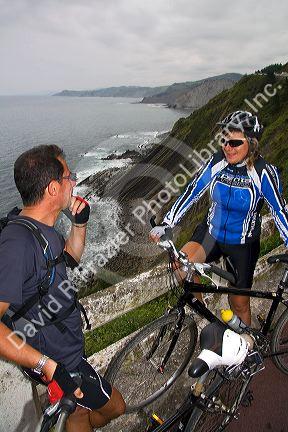 French bicyclists along the coast near Deba, Guipuzcoa, Basque Country, Spain. MR