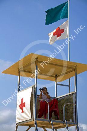 Lifeguard on the beach at La Concha Bay in the city of Donostia-San Sebastian, Guipuzcoa, Basque Country, Northern Spain.