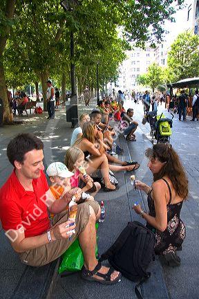Family eating ice cream in the city of Donostia-San Sebastian, Guipuzcoa, Basque Country, Northern Spain.