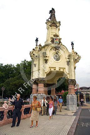 People walk across the Maria Cristina Bridge in the city of Donostia-San Sebastian, Guipuzcoa, Basque Country, Northern Spain.