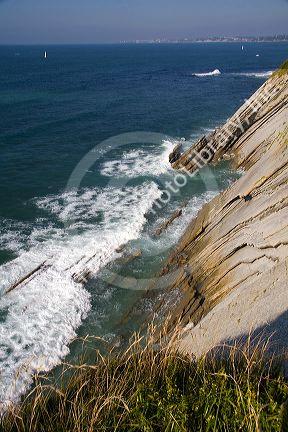 Coastal cliffs in the bay at Saint-Jean-de-Luz, Pyrenees Atlantiques, French Basque Country, Southwest France.