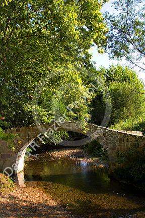 Stone footbridge near the village of Sare, Pyrenees-Atlantiques, French Basque Country, Southwest France.