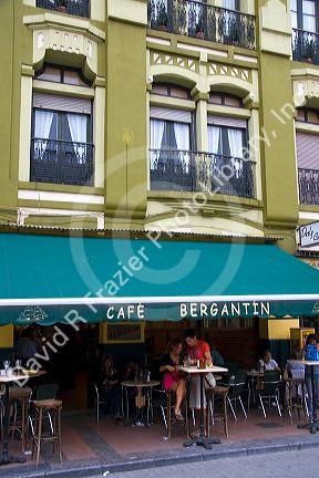 People dine outdoors at the Cafe Bergantin in the town of Ribadesella, Asturias, northern Spain.