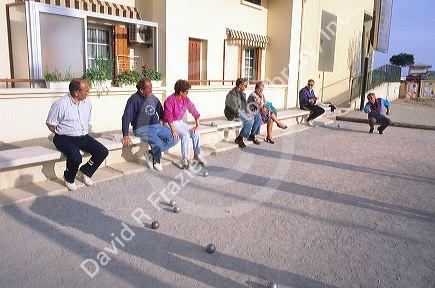 People play bocci ball in France.