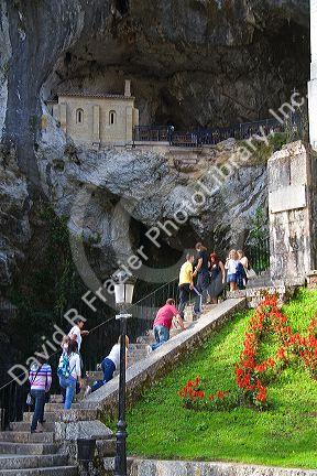 Visitors climb stairs to the Holy Cave at Covadonga, Asturias, northwestern Spain.