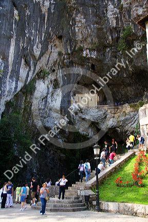 Visitors climb stairs to the Holy Cave at Covadonga, Asturias, northwestern Spain.