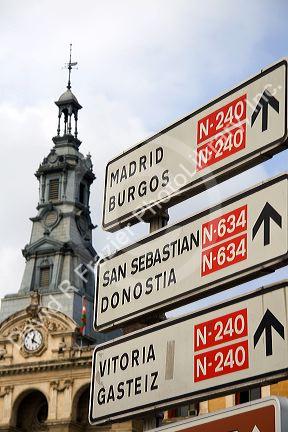 Direction sign and city hall in the city of Bilbao, Biscay, northern Spain.