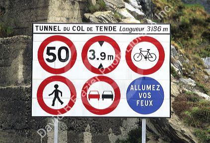 Signs at an entrance to a tunnel in France.