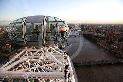 Tourists view the city of London from the London Eye, England.
