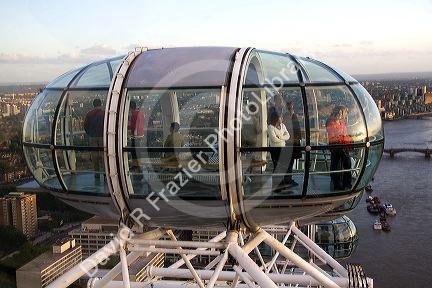 Tourists view the city of London from the London Eye, England.
