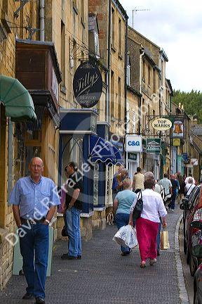 People walk and shop in the town of Moreton-in-Marsh, Gloucestershire, England.