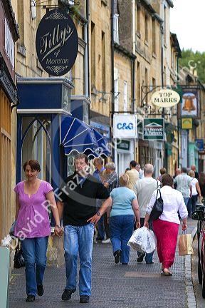 People walk and shop in the town of Moreton-in-Marsh, Gloucestershire, England.