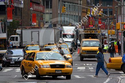 Taxicabs in Times Square, Manhattan, New York City, New York, USA.