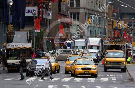 Pedestrians and traffic in Times Square, Manhattan, New York City, New York, USA.