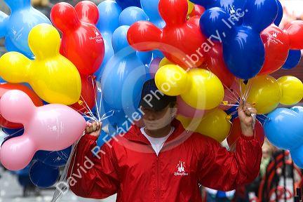 Promotional Disney balloons being handed out in Times Square, Manhattan, New York City, New York, USA.