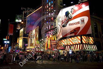 Pedestrians in Times Square at night in Manhattan, New York City, New York, USA.