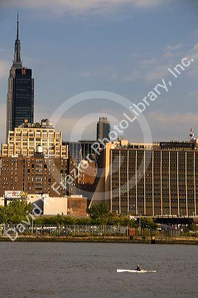 Sea kayaker on the Hudson River along Lower Manhattan, New York City, New York, USA.