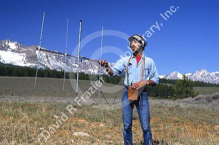 A wildlife biologist tracks animals that have been tagged.